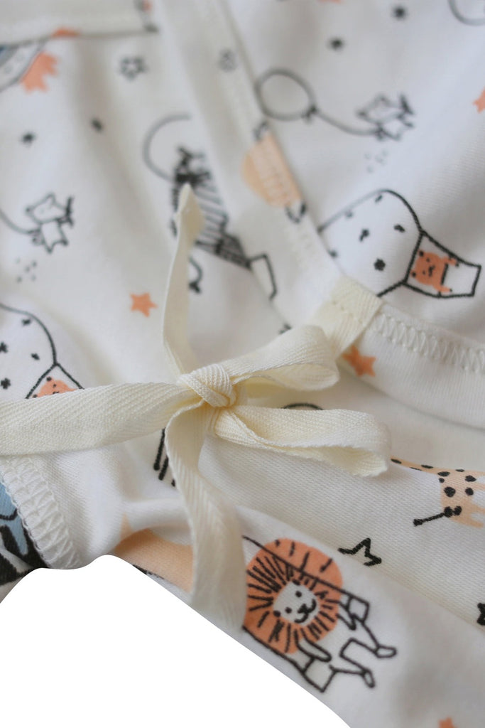 Close up detail of the organic cotton tie on our Space Print Baby Kimono Onesie. 